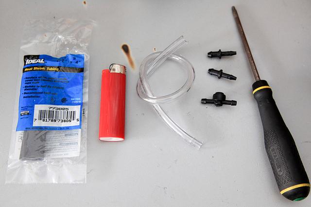 Shrink wrap tubing, lighter, clear plastic tubing, torx 20 screwdriver, plastic fittings