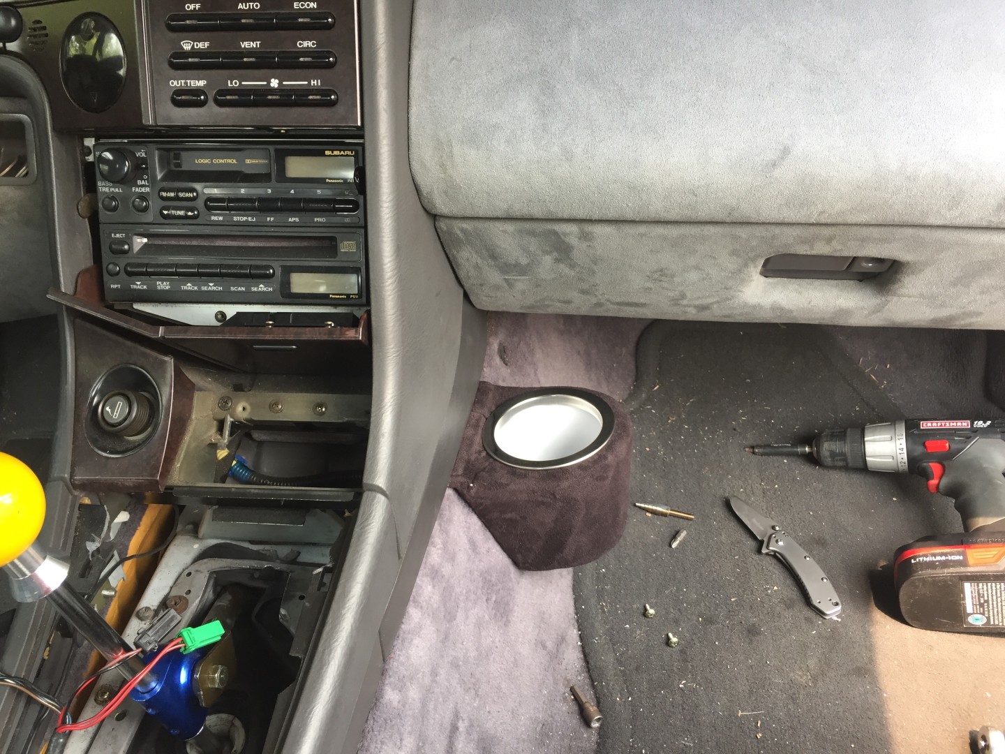 Custom printed cupholder! its since turned to grey suede to match the interior more.