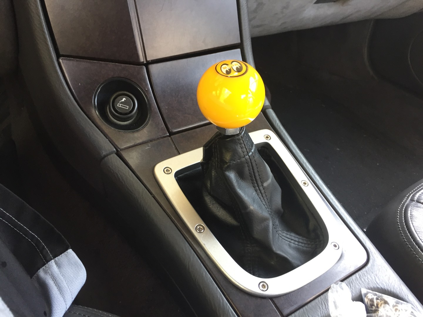 small update from back when. i fitted a bezel to the shift surround and a boot. Later I fixed the boot to fit the shifter diameter.
I've since switched to an STi shift knob.