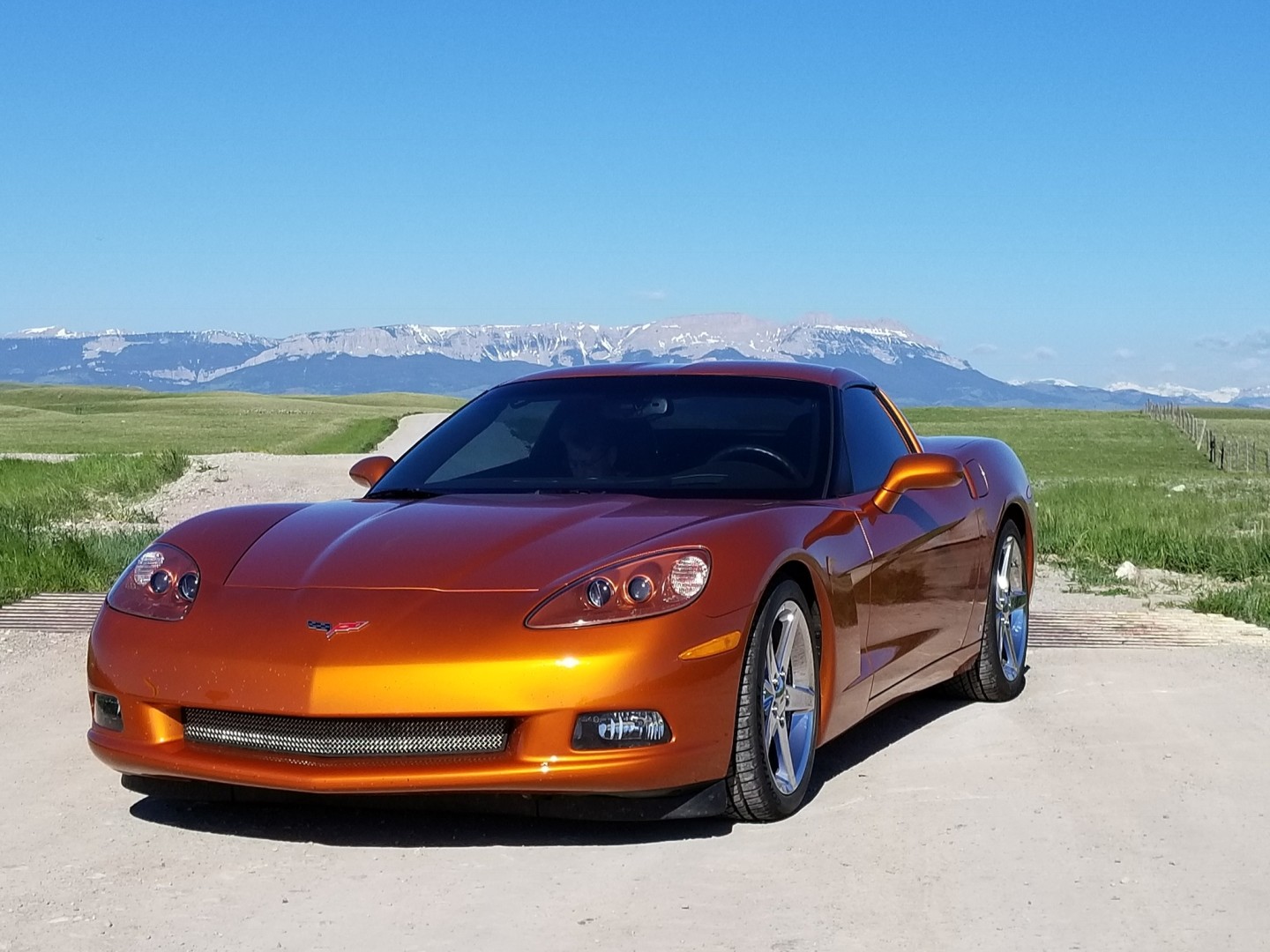 Atomic Orange C6 on Rocky Mountain backdrop.