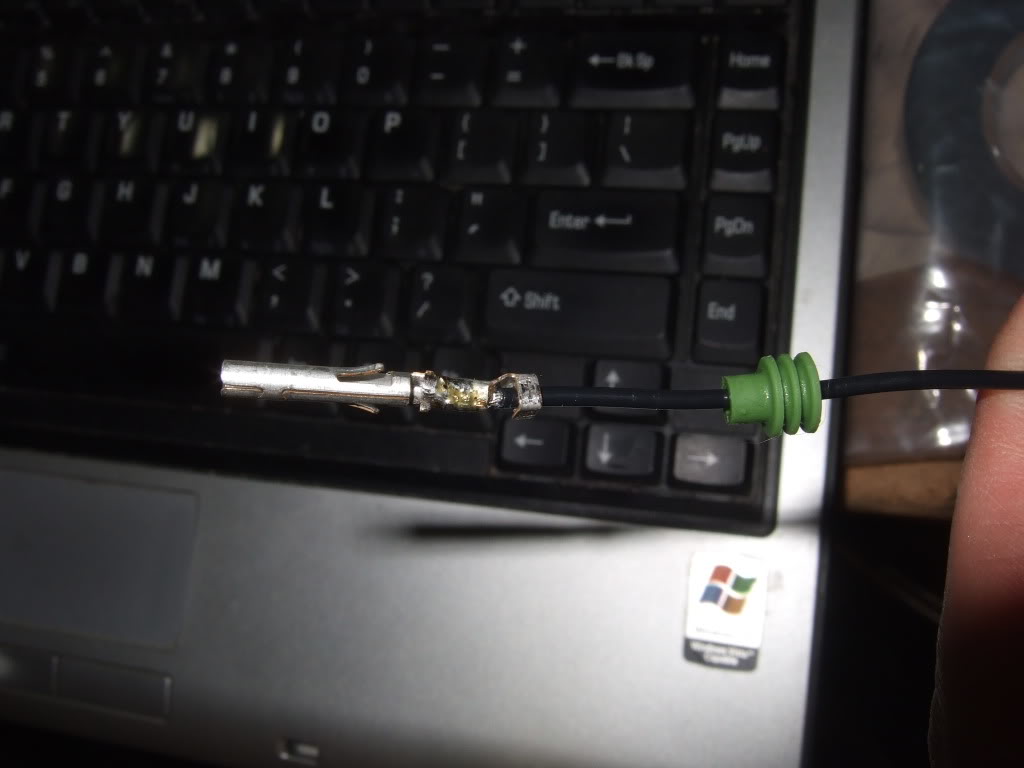wire with green boot and crimped connecter end
