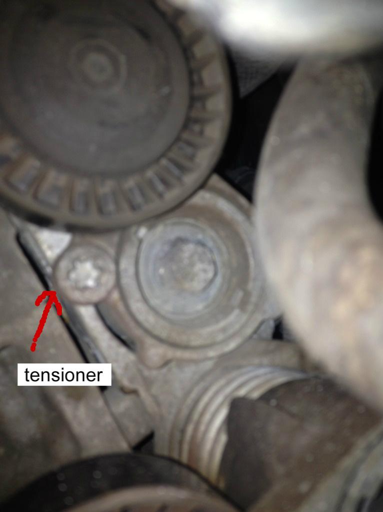 removing the accessories belts by loosing tensioner