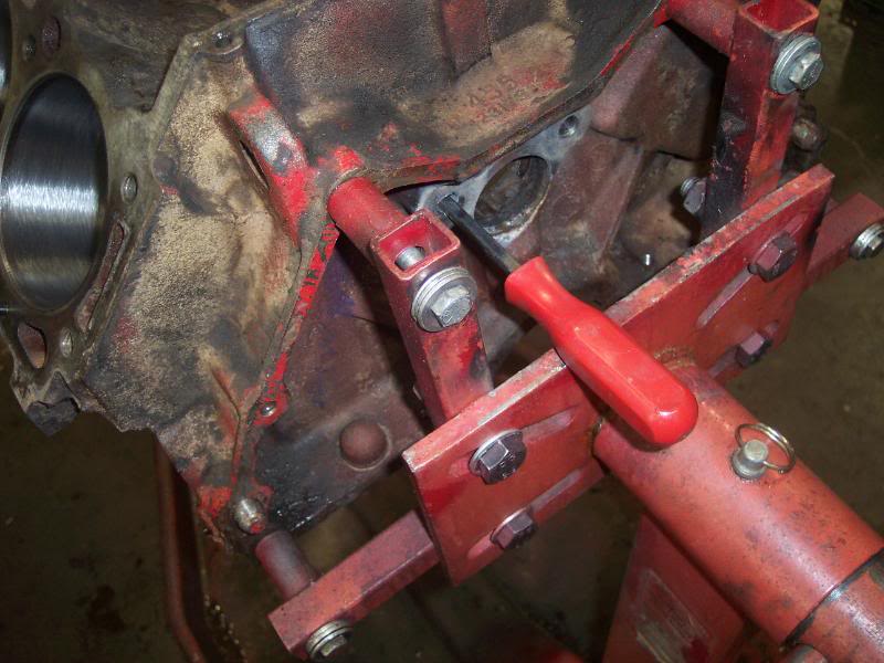 put it down the hole on each side, and tap them out