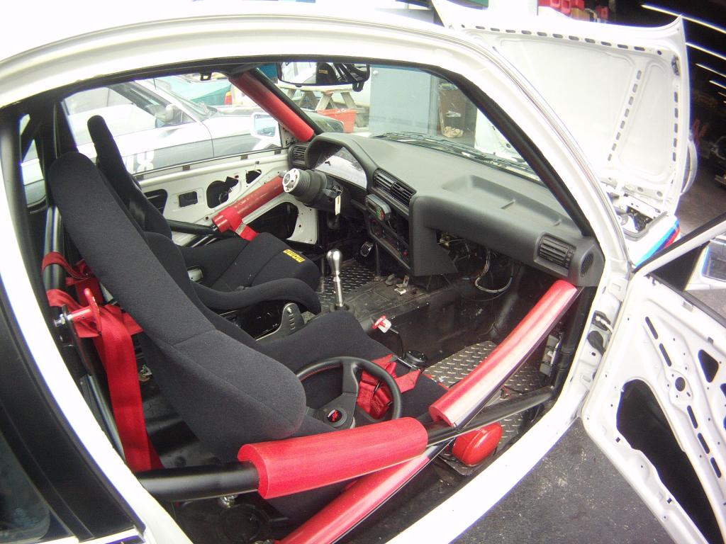 BMW E30 race car interior with roll cage