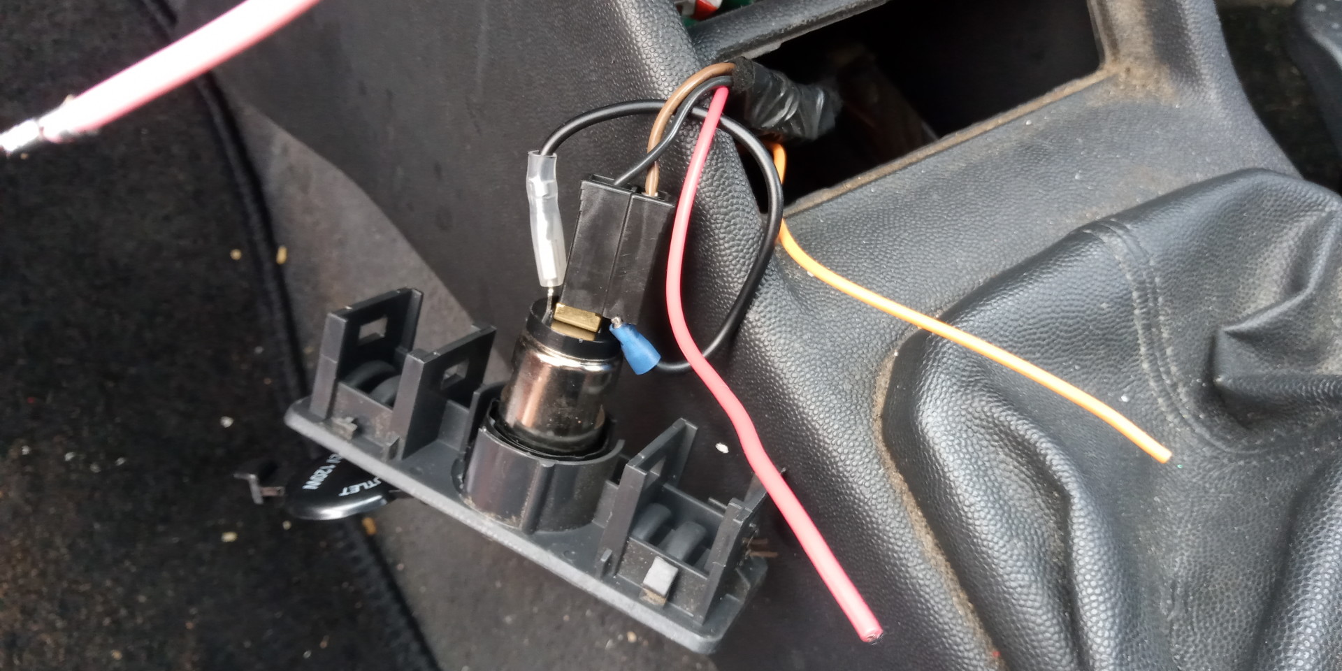 Lighter socket showing my two cables that I need to connect. Could someone tell me where they go please?