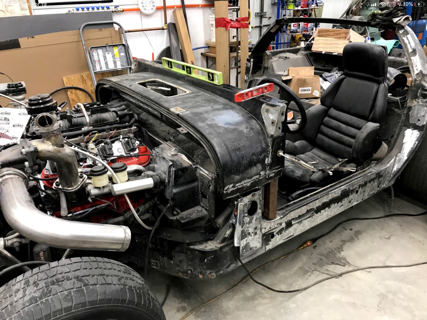 Fitting the YJ cowl to the C4 chassis. The vette was several inches wider, so I had to shave the front door pillars so it would fit.