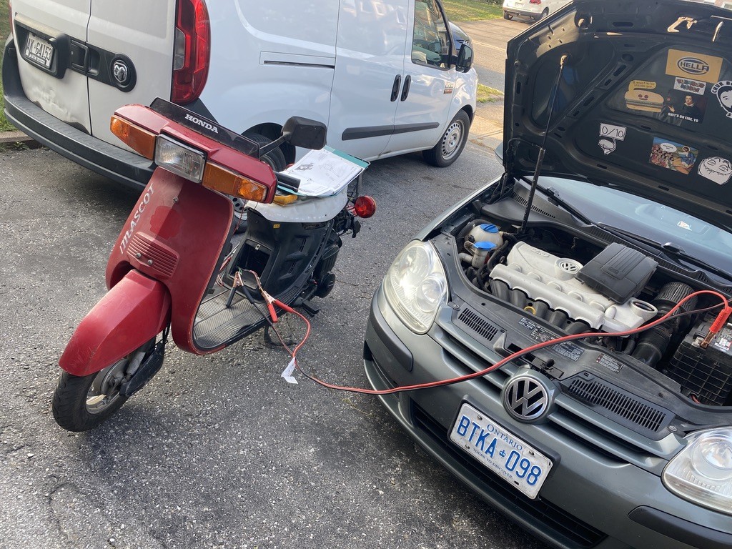 The next big hurdle was the electrical. The scooter had been all apart more than once and in those tear downs it seems wiring was... Forgotten. The left turn signal was hooked to the headlight switch, the other signals didnt work but the relay did, the headlight was not working but hooked up, starter didnt work, highbeams didnt work, the OIL light was on all the time as was the brake light and the horn was nonexistent. I realized that a lot of these functions would not operate without constant 12V as the little alternator just wasnt strong enough without a battery. I disconnected everything, printed out a few wiring diagrams for the NH80 models and did what I do best as an electrician; wired.
I ended up getting the starter to work, signals to work, headlight and dash to work, all the warning lights to work, high beams, low beams and the brake light working from one hand brake.
The rear brake handle has an internal wiring issue I will have to solve but it also need a rear brake cable so that will all happen at the same time.
The only other thing I could not get to work was the speedo.