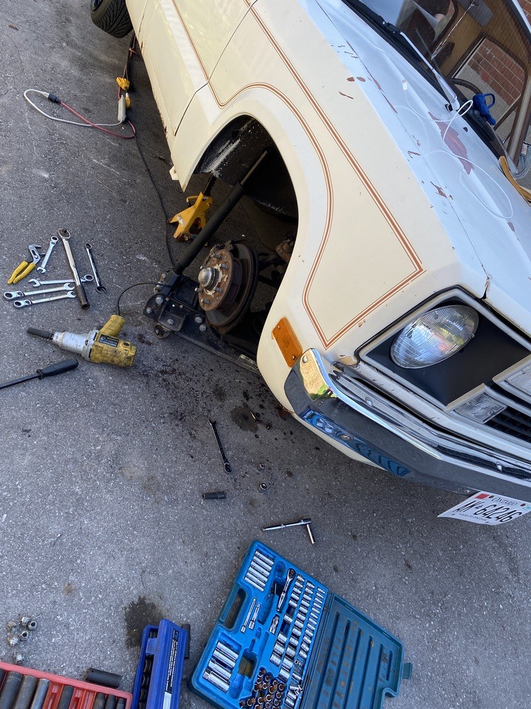 The front was more of a challenge. I had to cut the sway bar end links to get them not to bind but also to allow the coil spring to be removed for cutting. 