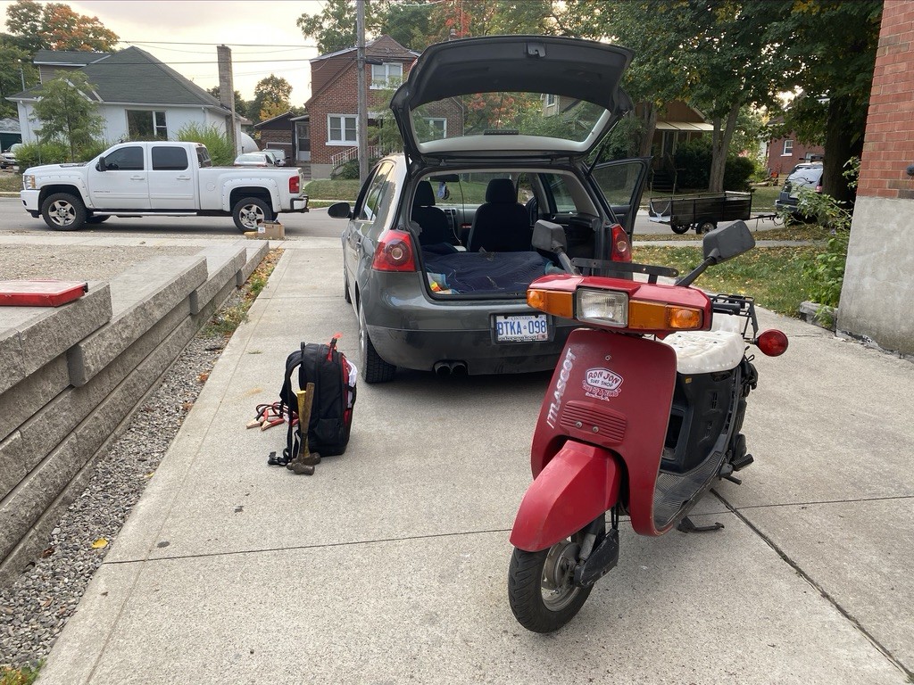 I don't own a capable truck and the scooter was an hour plus away from my house so I did what any sane person would do; I loaded it into my '08 Rabbit