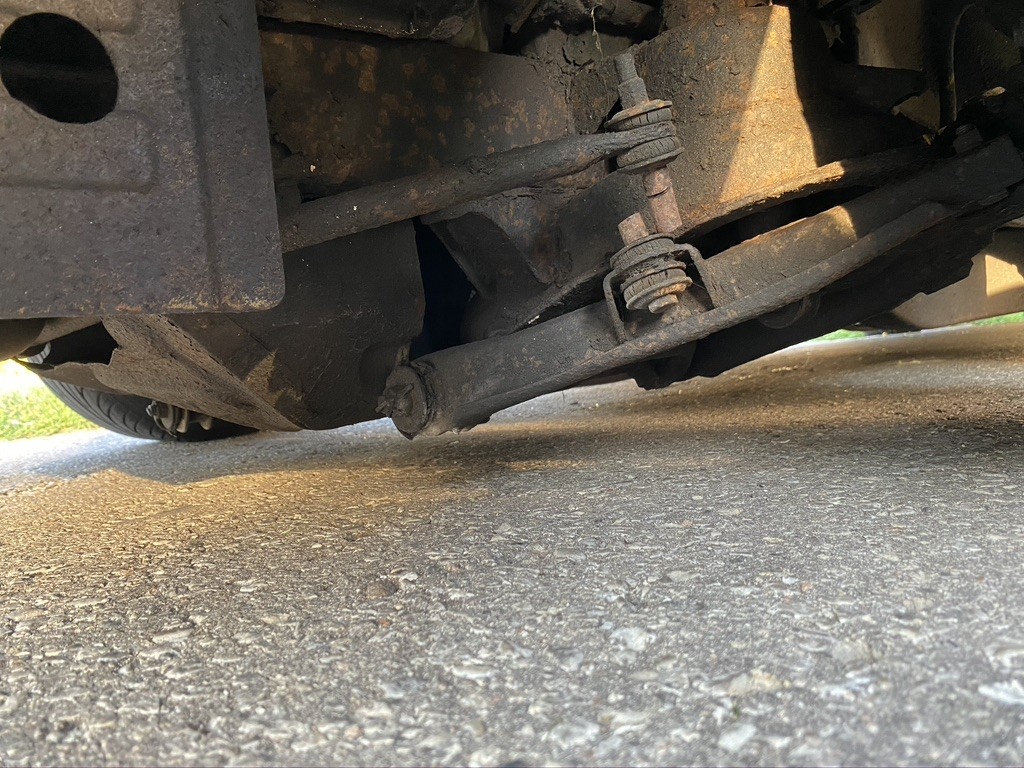 Here is the clearance up front. You can see the cut end links as well. I have to update all of these parts anyhow as the bushings are all toast but the plan is to get Mazda B2000 drop spindles to correct the suspension geometry and hopefully gain some clearance/suspension travel while still remaining low