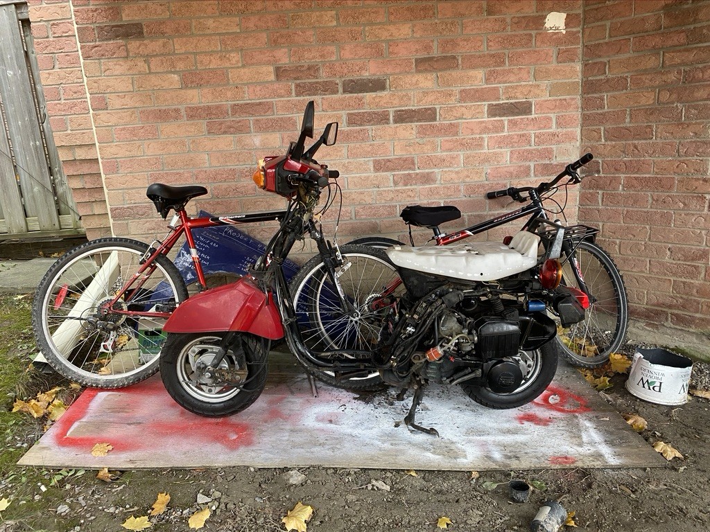 All stripped, fuel stabilized, oil refreshed and joints lubed. Winter storage spot is mostly out of the weather and I got a nice BBQ cover for it as an extra precaution. I'm for the most part done with the physical bike for the winter as its just too cold to work on it and I have no space inside I can get that dirty. I will be continuing with the body work however AND first thing in the spring the new suspension goes in for that low look. I also managed to get the ownership for it so once I write my M1 class licence I can legally scoot anywhere! 