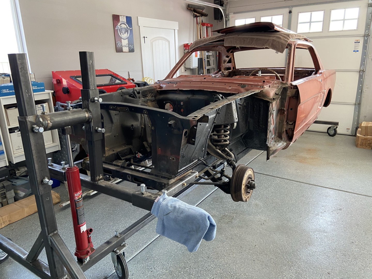 Put the car on a rotisserie in order to get the best of the media blasting and easier access to remove as much of the rubber undercoating as possible. 